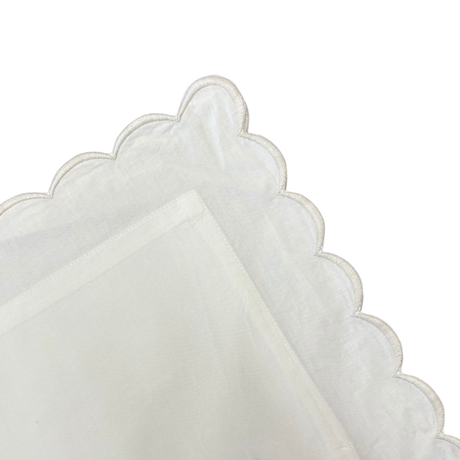 White pillow with grey trim