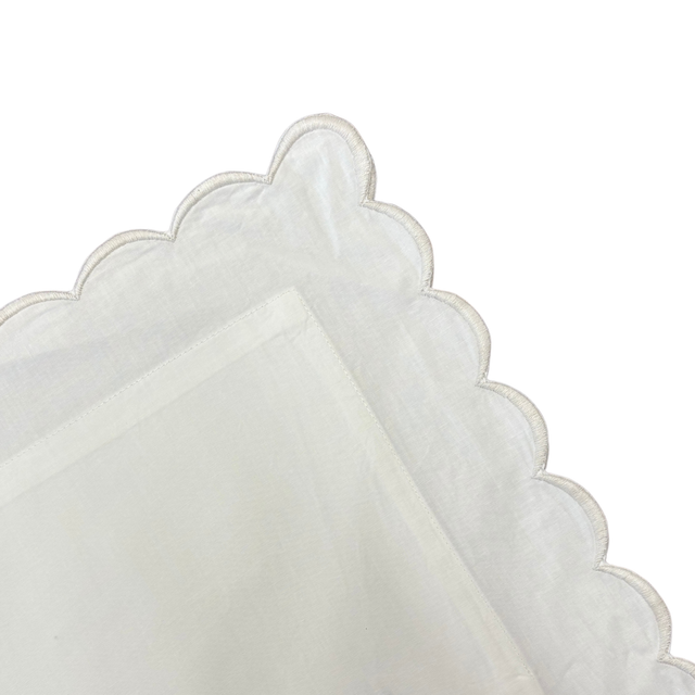 White pillow with grey trim