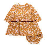 Children's outfit with a mustard yellow and white pattern on a white background