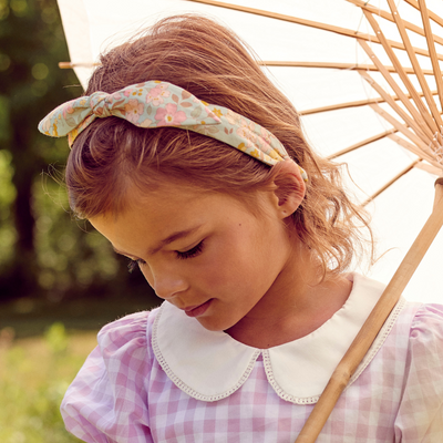 a little girl wearing Lola Hairband in Meadow Flowers