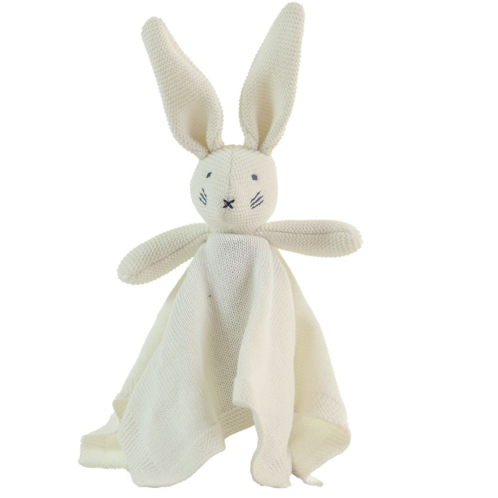 Knitted bunny toy with a white blanket on a white background