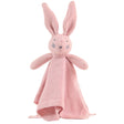 Pink knitted bunny toy with a blanket on a white background