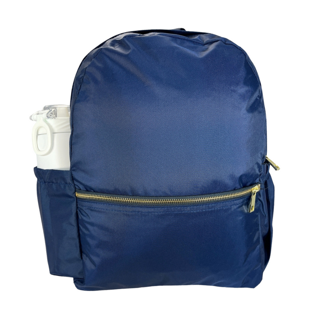 Navy backpack with gold zipper on white background