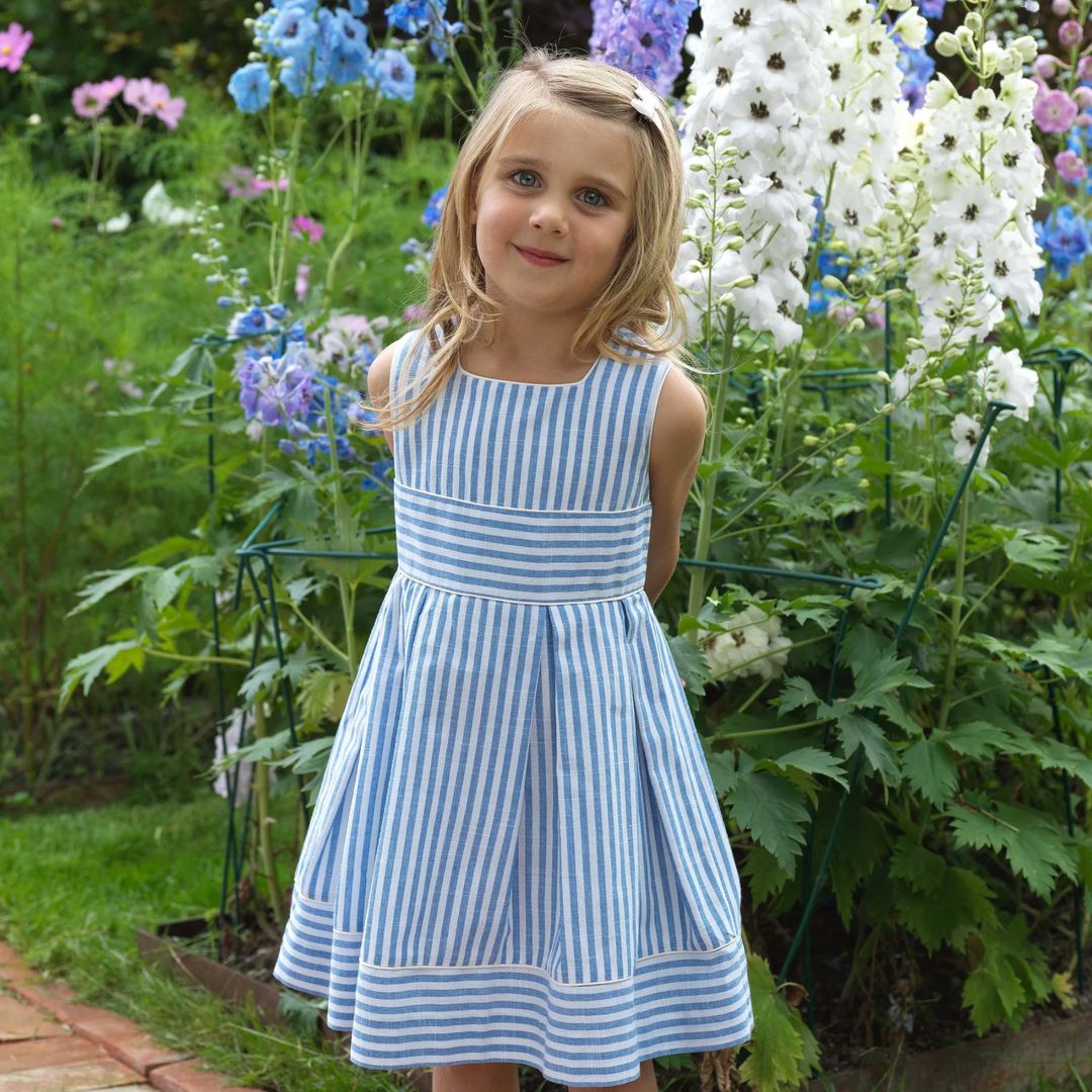 a girl at the garden wearing Oxford Stripe Pleated Dress