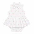 White baby pima dress with pink unicorn pattern on a white background