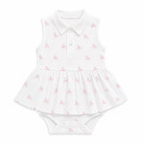 White baby pima dress with pink unicorn pattern on a white background