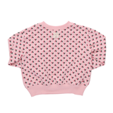Pink sweatshirt with heart pattern on a white background