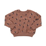 Brown sweatshirt with a pattern of people playing sports on a white background