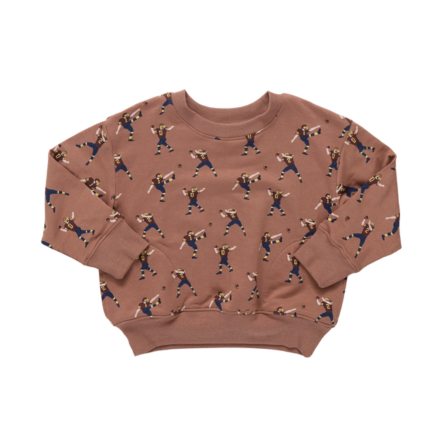 Brown sweatshirt with a pattern of people playing sports on a white background