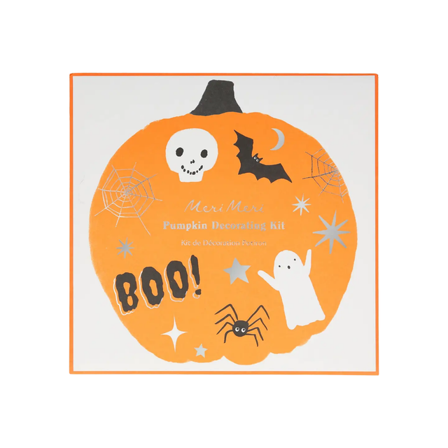 Halloween pumpkin decorating kit with decorative elements on a white background