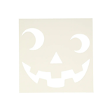 White pumpkin face cutout on a beige background