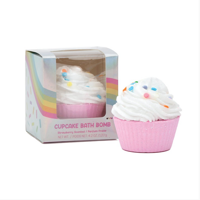 Cupcake-shaped bath bomb with pink base and white frosting, displayed in a clear box with rainbow design.
