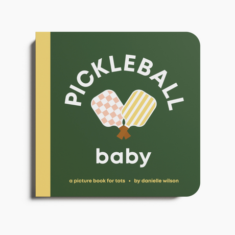 Book titled 'Pickleball Baby' with pickleball paddle and ball illustration on a green background