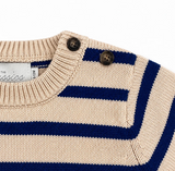 Close-up of a beige and blue striped sweater with button details on a white background.