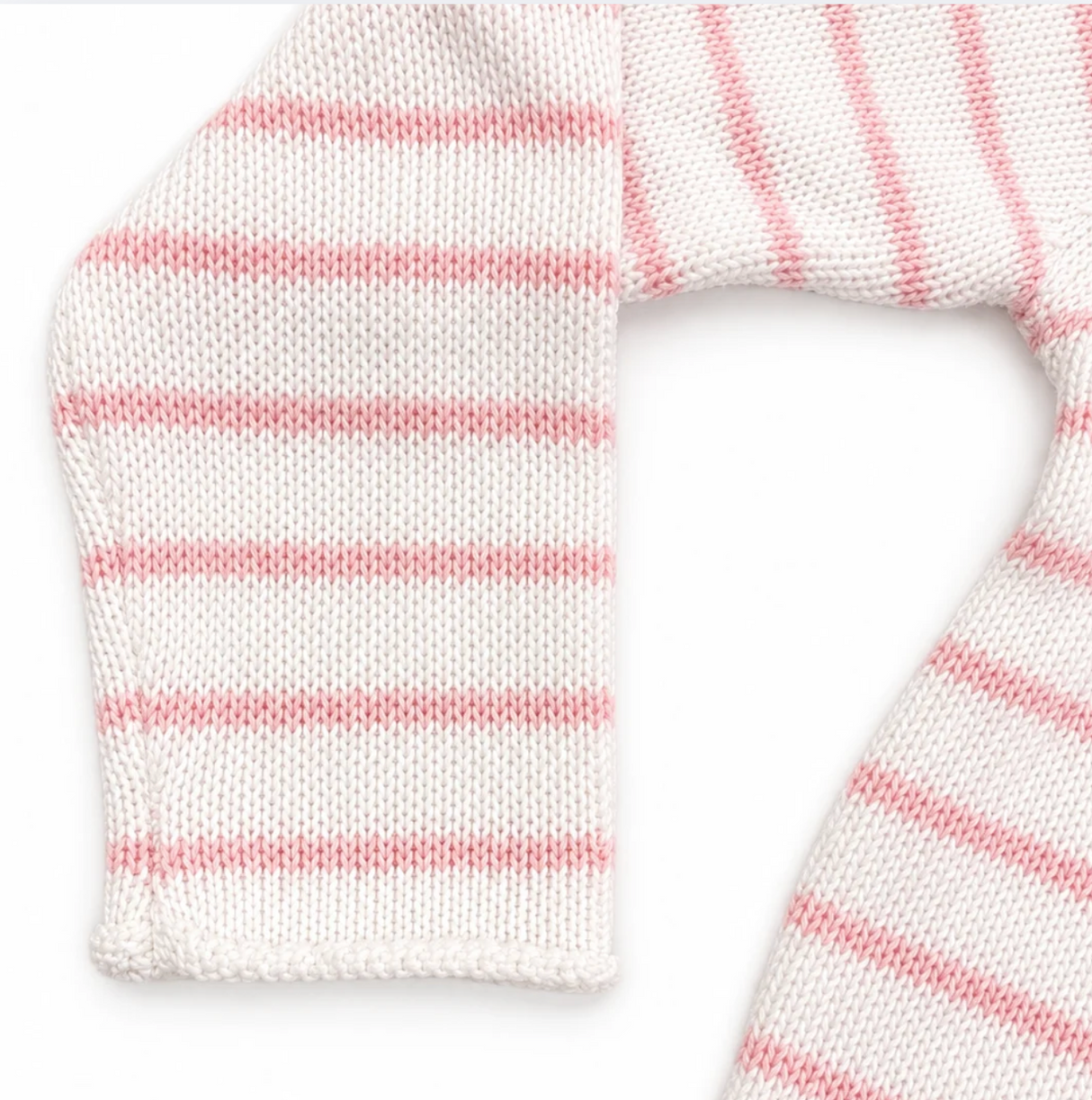 Close-up of a white knitted scarf with pink stripes on a white background
