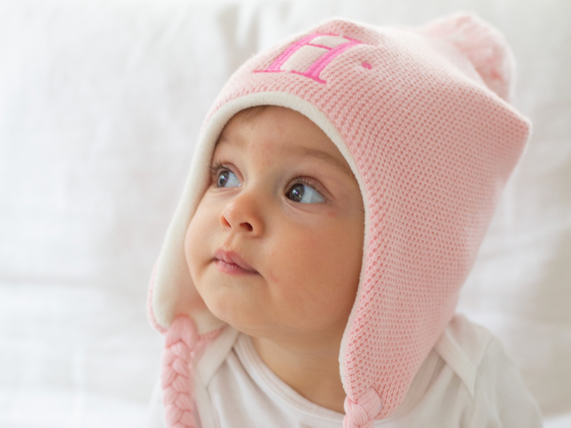 baby with pink hat