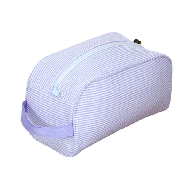 Purple striped toiletry bag on a white background