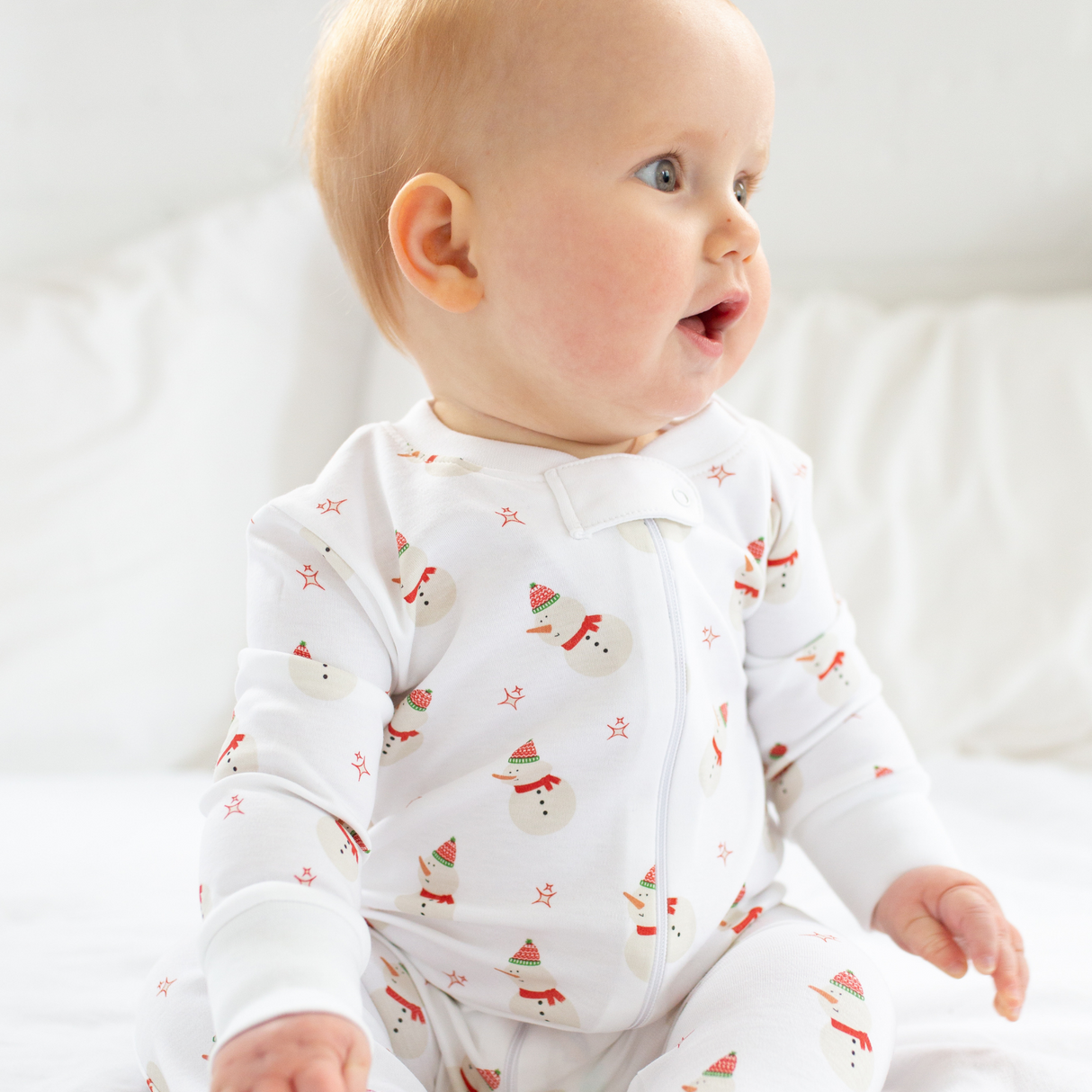 a baby wearing Snowman Zipper Romper