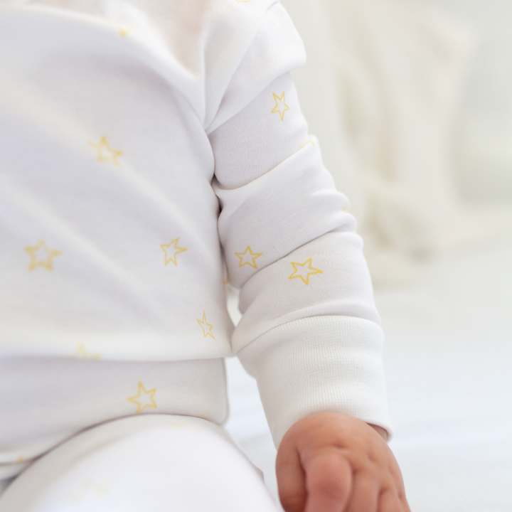 a baby wearing Tiny Stars Pajama Set in Yellow