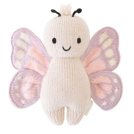 Knitted butterfly toy with pink and purple wings on a white background