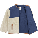 Two-tone jacket with blue and beige sections on a white background