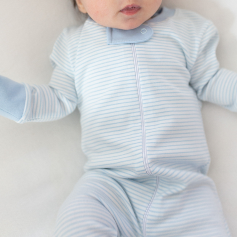 a baby wearing Classic Stripe Zipper Romper in Light Blue details 1