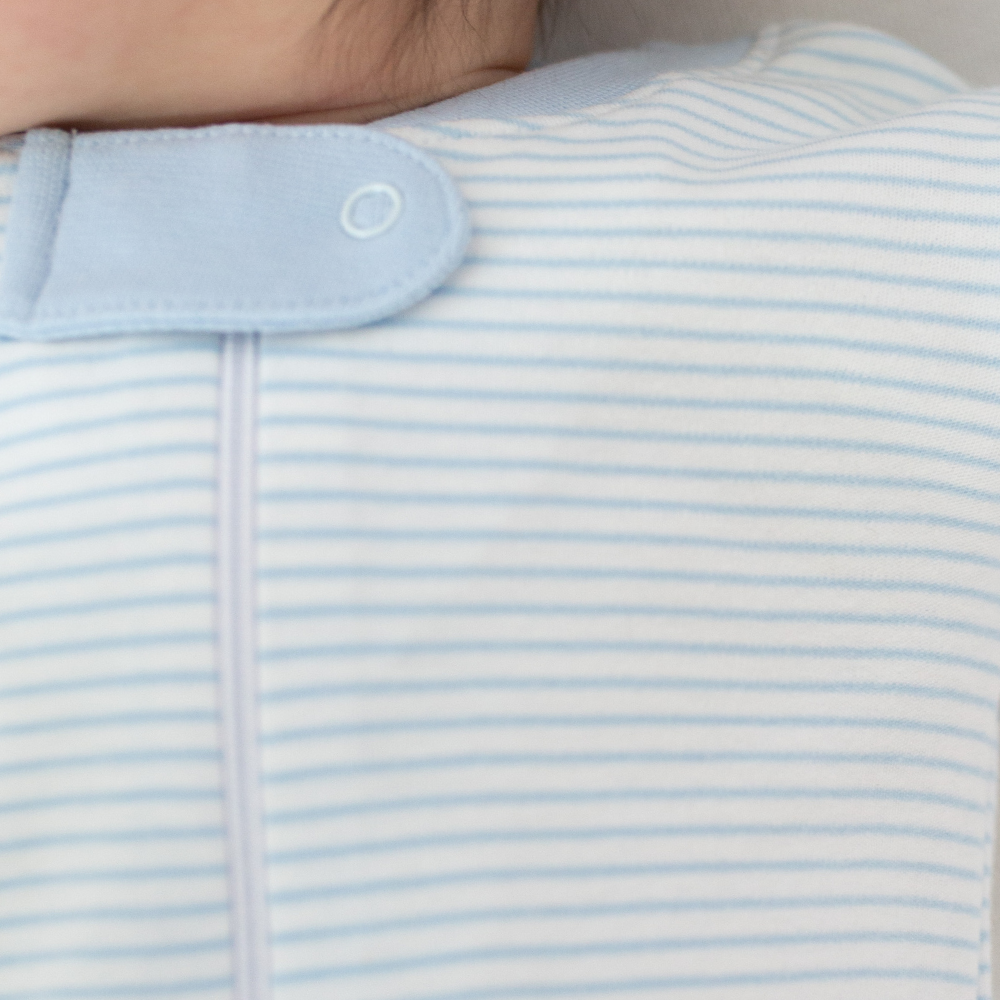 a baby wearing Classic Stripe Zipper Romper in Light Blue details 3