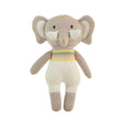 Knitted toy elephant with a striped sweater on a white background